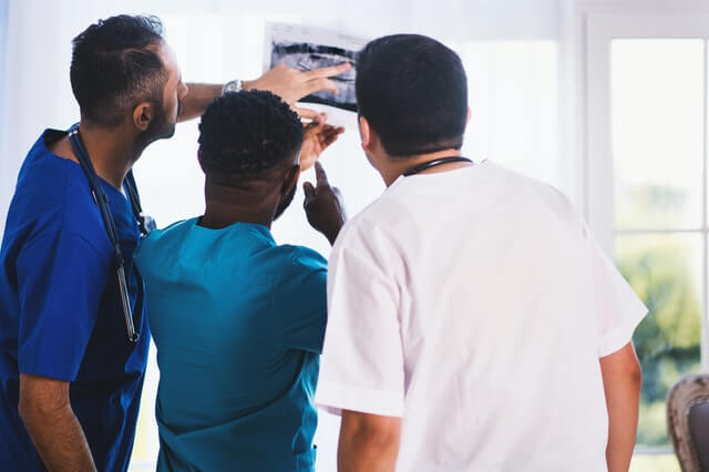 What are catastrophic injuries three doctors looking at xray
