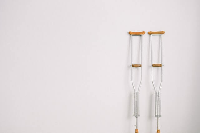 Crutches leaning against wall car accident injury