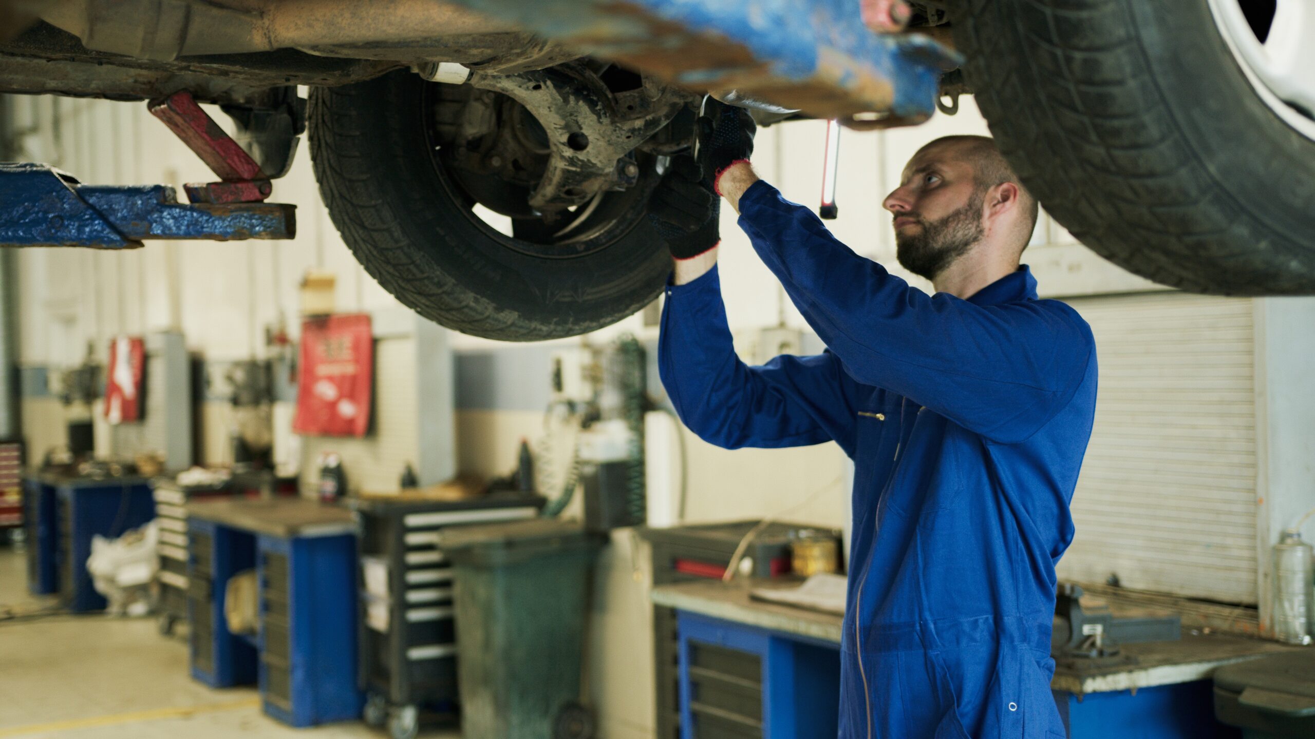 a car mechanic preparing a vehicle